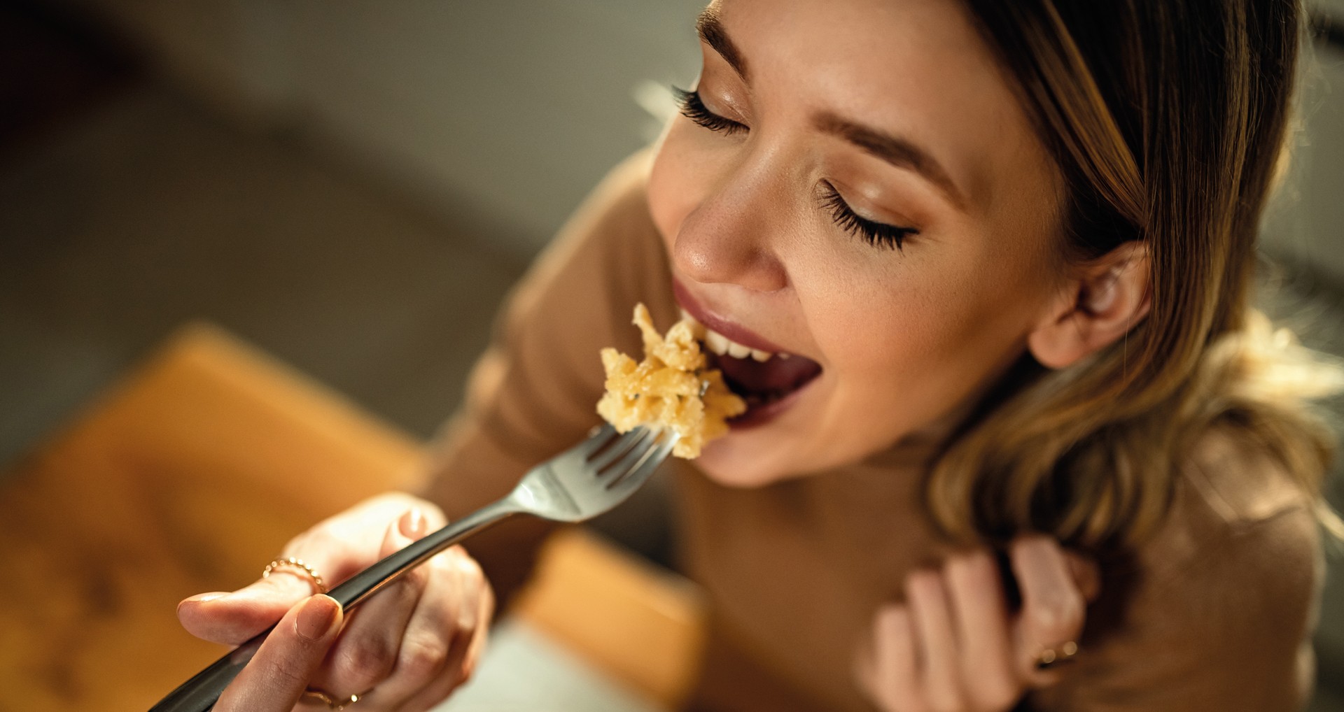 happy woman eating pasta.jpg